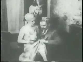 Two flappers dance naked with dude then rub and tug his penis together