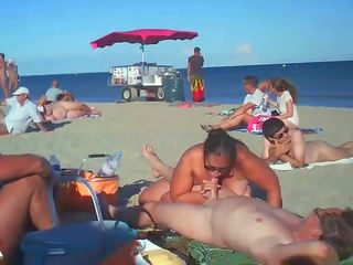 Milf Blows Her young lady On Nude Beach By Voyeurs